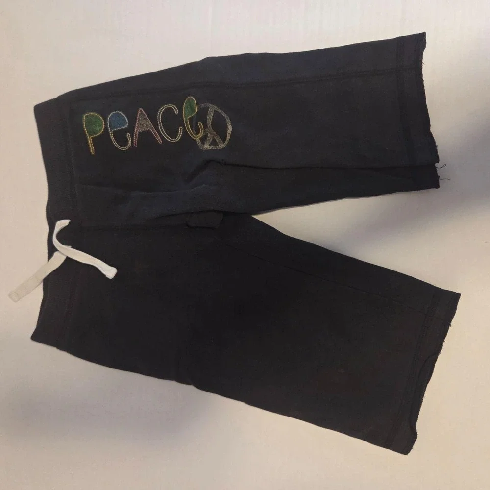 Super cozy black Hanes sweat shorts featuring a vibran